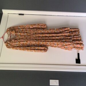 Floral mustard dress with ruffles and long sleeves